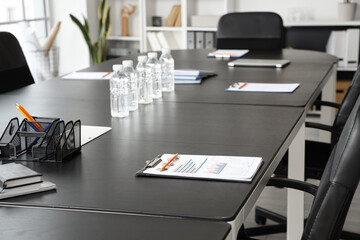 Clipboard with charts on table in office prepared for meeting, closeup