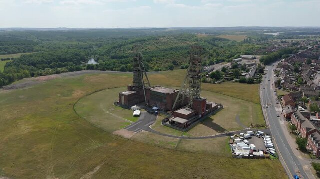 Aerial drone view of coal colliery mine site, industrial revolution legacy infrastructure extracting energy materials from earth Clipstone, Notttingham, England. 