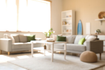 Interior of modern stylish room with surfboard and sofas