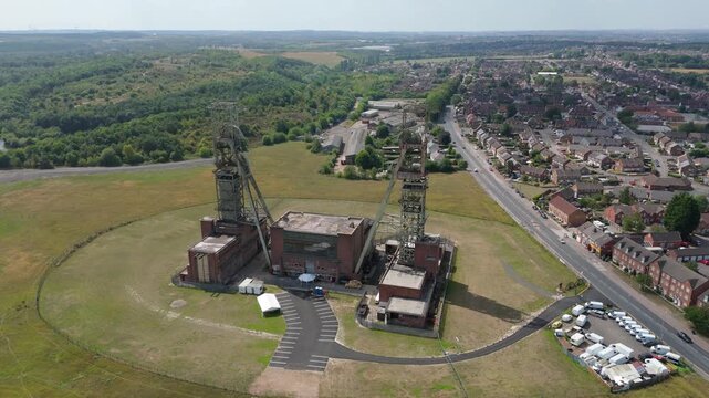 Aerial drone view of coal colliery mine site, industrial revolution legacy infrastructure extracting energy materials from earth Clipstone, Notttingham, England. 