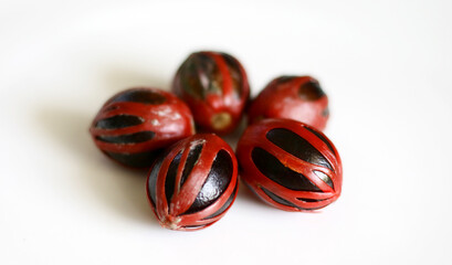Nutmeg seeds on a white background.