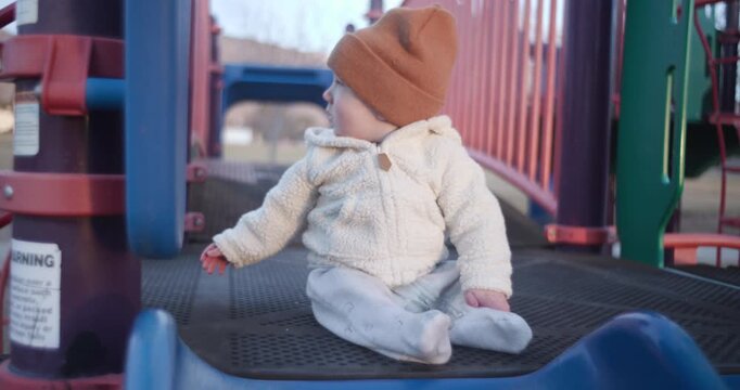 Cute Baby Waving on Playground