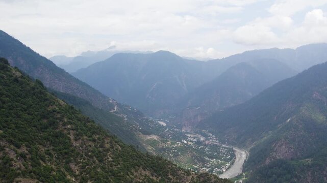 Athmuqam village with the Kishan Ganga River flowing through lush Himalayan mountains. Azad Kashmir
