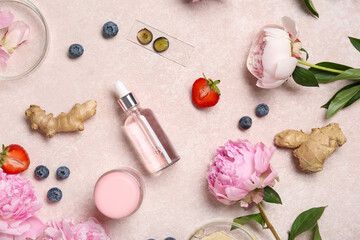 Natural cosmetic products on grunge background, top view