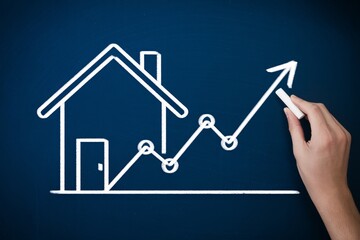 Real estate market growth concept, chalk house and rising arrow on blue board, property investment trend.