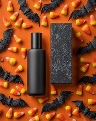 Foundation bottle and box packaging mockup, flat lay with bats and candy scattered around, orange-black background, clear central copy space