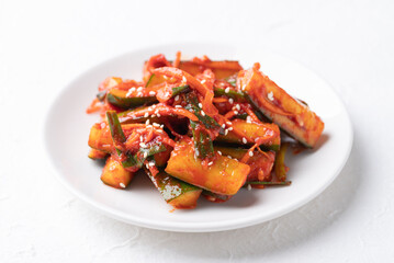 Korean kimchi cucumber on white plate, Korean side dish, Homemade food