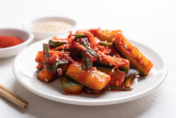 Korean kimchi cucumber on white plate, Korean side dish, Homemade food