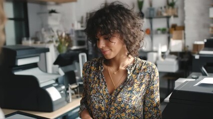 Woman engaging in conversation at a modern cafe located in an urban setting during daytime, highlighting a vibrant atmosphere - Powered by Adobe
