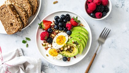 Healthy Breakfast Bowl with Avocado, Eggs, and Berries on a Plate, Nutritious and Colorful Breakfast with Grain Bread on a Textured Background