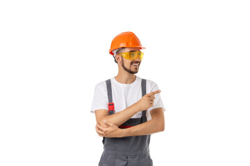 Cheerful worker in safety gear points, isolated on white, PNG