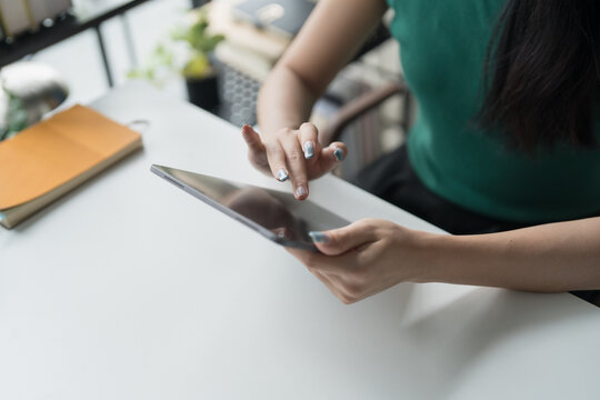 Asian woman Graphic designer working on digital tablet. artist drawing on graphic tablet female Artist Creative Designer sketch graphic drawing creative studying work