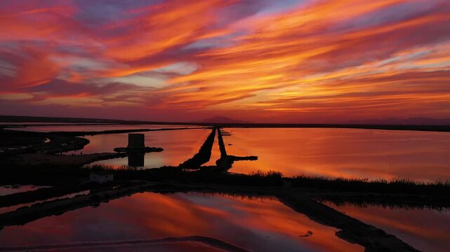 Aerial view during the sunset of a antique watchtower close to Santapola Cape, in Alicante, Spain.