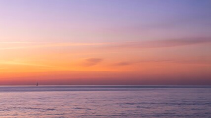 Soft pastel colors of a tranquil ocean horizon at sunset or sunrise