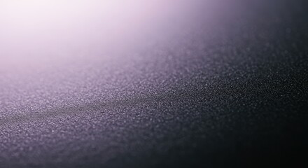 Abstract textured background with gradient light and dark tones.