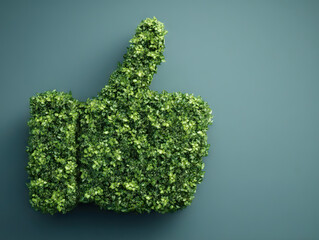 Green thumbs up symbol made of lush foliage against plain background, symbolizing eco friendliness and sustainability