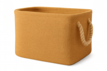 Studio shot of an empty, rectangular, woven, ochre storage basket with rope handles, isolated on a transparent background