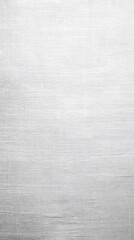 Fototapeta premium Close-up view of a smooth, light gray fabric or metal surface. Fine, subtle horizontal lines are visible