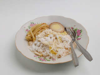 Nasi Liwet is a traditional Indonesian cuisine made from savory rice served with vegetable curry and boiled egg