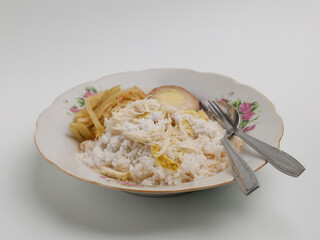 Nasi Liwet is a traditional Indonesian cuisine made from savory rice served with vegetable curry and boiled egg