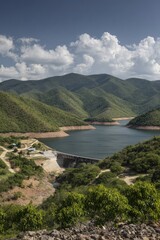 Mountainous landscape with a reservoir and dam
