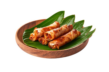Front view of a wooden plate with a banana leaf inside, placed on a surface, containing 3 crispy and juicy chicken spring rolls
