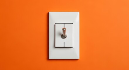 A vintage toggle light switch with a metal handle, mounted on a white plate against a vibrant orange background, representing power and control