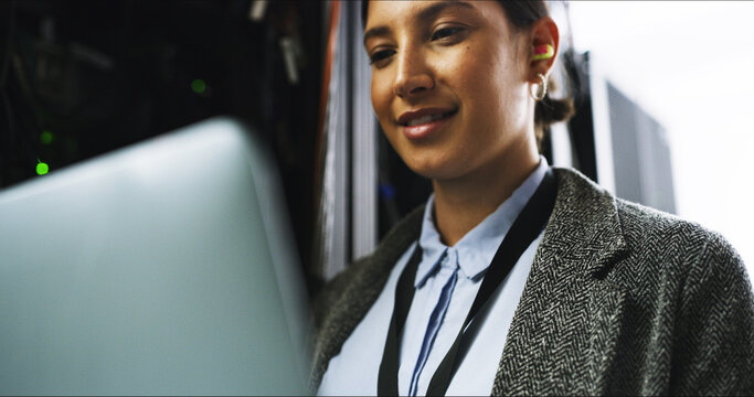 Cybersecurity, testing or woman on laptop for engineering, repair or inspection in server room. Information technology, programming or IT technician with data for maintenance, backup or control panel