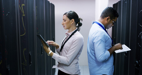 Man, woman and tablet with teamwork in server room for technical support, software update or online maintenance. Inspection, partner and upgrade with information technology solution in data center