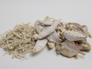 Raw salted fish on white background