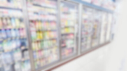 Blurred supermarket refrigerated drink aisle perspective