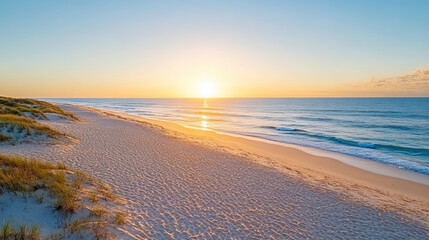 Obraz premium Golden sun rising over tranquil beach soft waves lapping at sandy shore