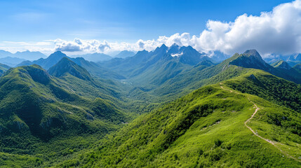 Fototapeta premium Lush green mountains and valleys stretch bright blue sky, showcasing nature beauty and serenity