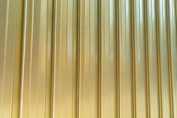 Metallic vertical lines on a golden surface