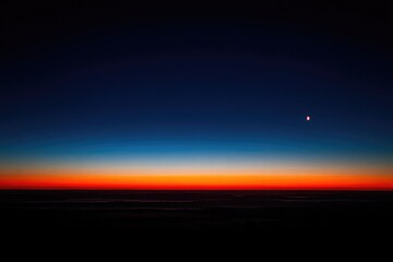 Dark sky, vibrant sunrise horizon