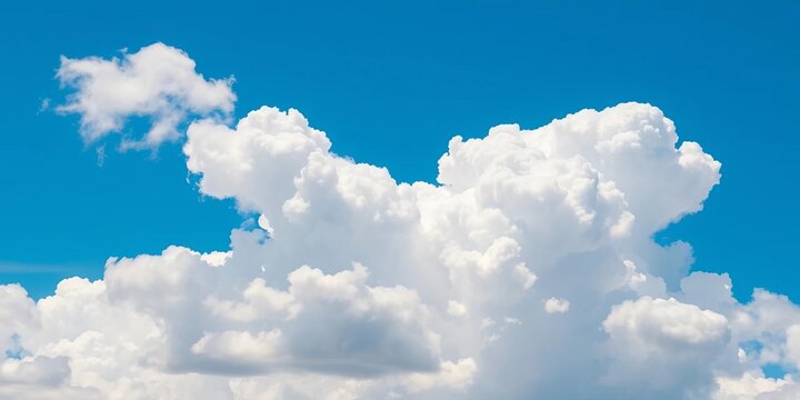 Stunning isolated fluffy white clouds against a vibrant blue sky,  summer,  panoramic