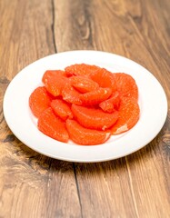 Fresh grapefruit slices on a plate