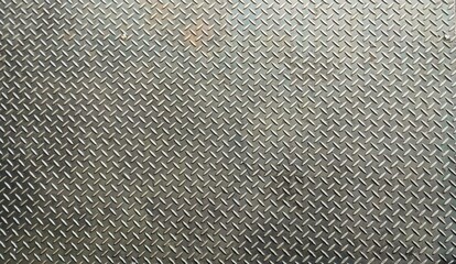 Old Steel plate texture background. Seamless metal floor plate with diamond pattern. repeating raised diamond-shaped pattern across its surface, providing traction and slip resistance.