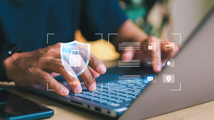Close-up of hands typing on laptop with digital login interface overlay, username and password...