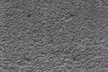 Rough surface of grey concrete wall close up background. Uneven cement wall texture.	
