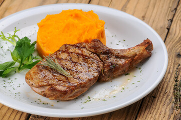 A piece of grilled pork loin on a white plate