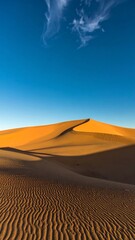 Golden desert dunes under a vibrant sky