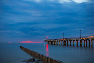 Obraz premium Pier in the evening after sunset in the Baltic Sea