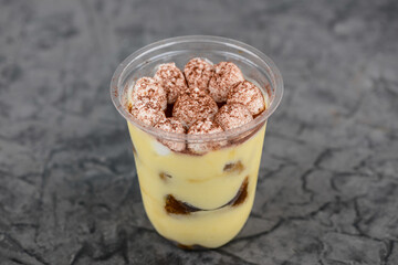 tiramisu dessert in disposable dishes