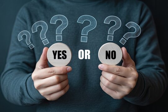 Person holding two circular objects with yes and no written on them surrounded by question marks symbolizing a choice or decision