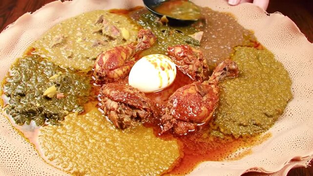 Ethiopian cuisine featuring injera bread and various stews and dishes.