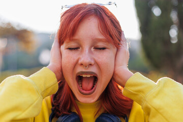 Young girl angry and screaming. Upset girl screaming. shock and emotional breakdown, depression.