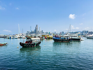Fishing Boats in Causeway Bay Typhoon Shelter with city skyline in Hong Kong