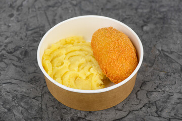 mashed potatoes with Kiev-style cutlet in disposable dishes