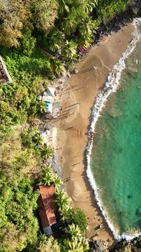 Praia do Cachorro in Fernando de Noronha, a small yet iconic beach known for crystal-clear water, rocky coast, and vibrant tropical scenery in Brazil